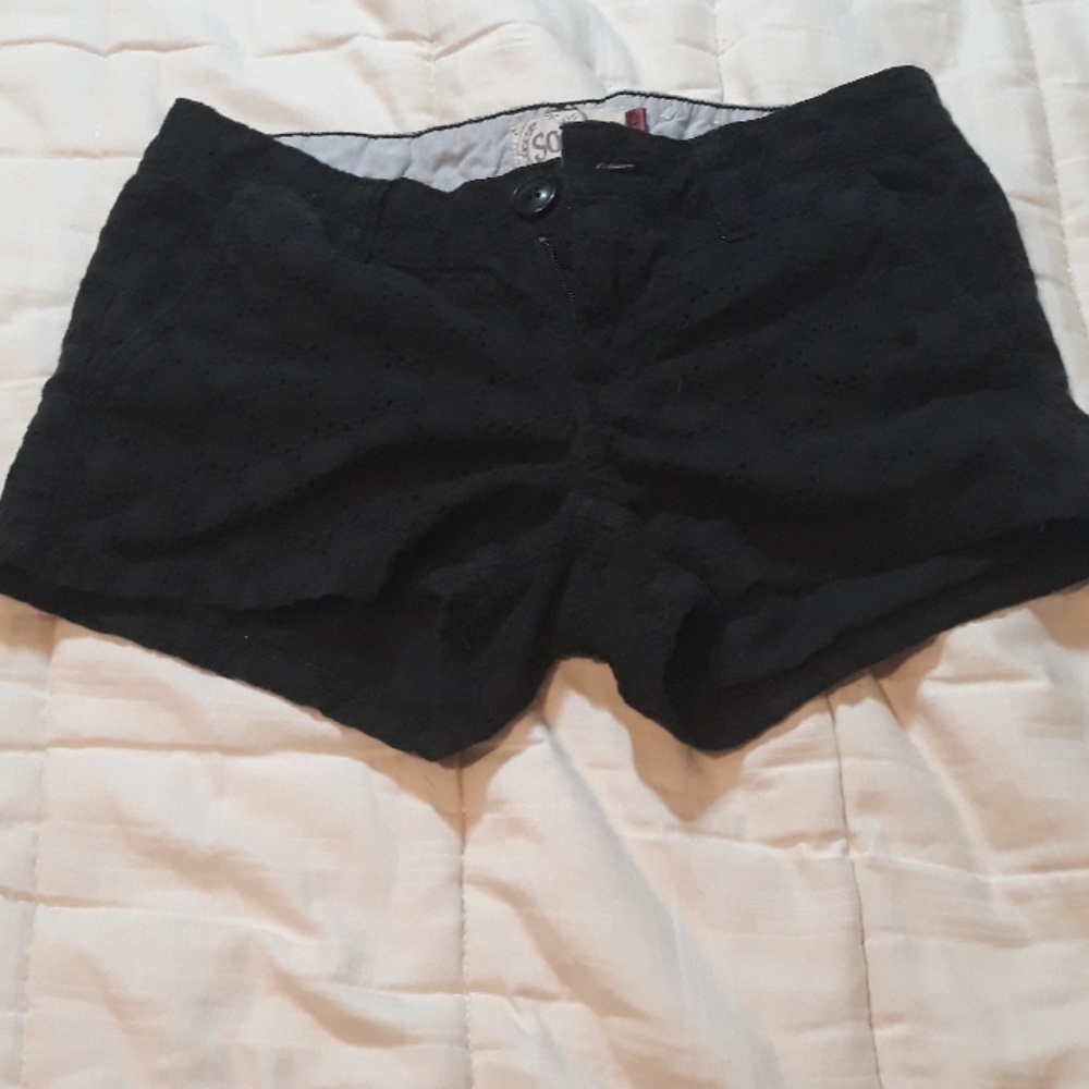 Black shorts with patterns in them.